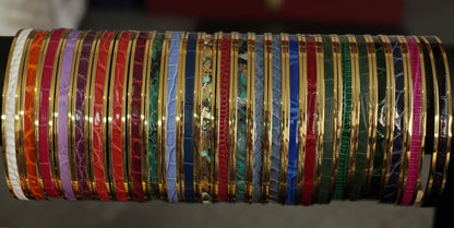 Bracelet en acier inoxydable plaqué or 24 carats et cuir éxotique (alligator, lézard, serpent)